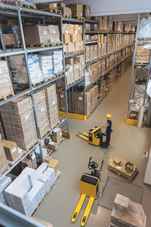 big warehouse with forklift and boxes