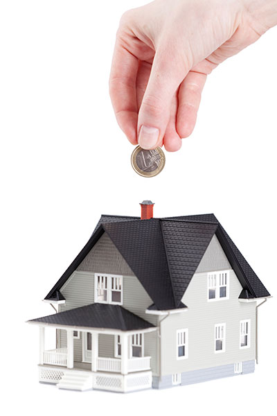 house drawing with a hand putting a coin over the chimney house drawing with a hand putting a coin over the chimney