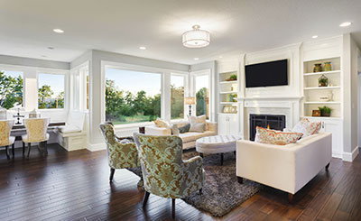 living room with sofa chairs and large white windows
